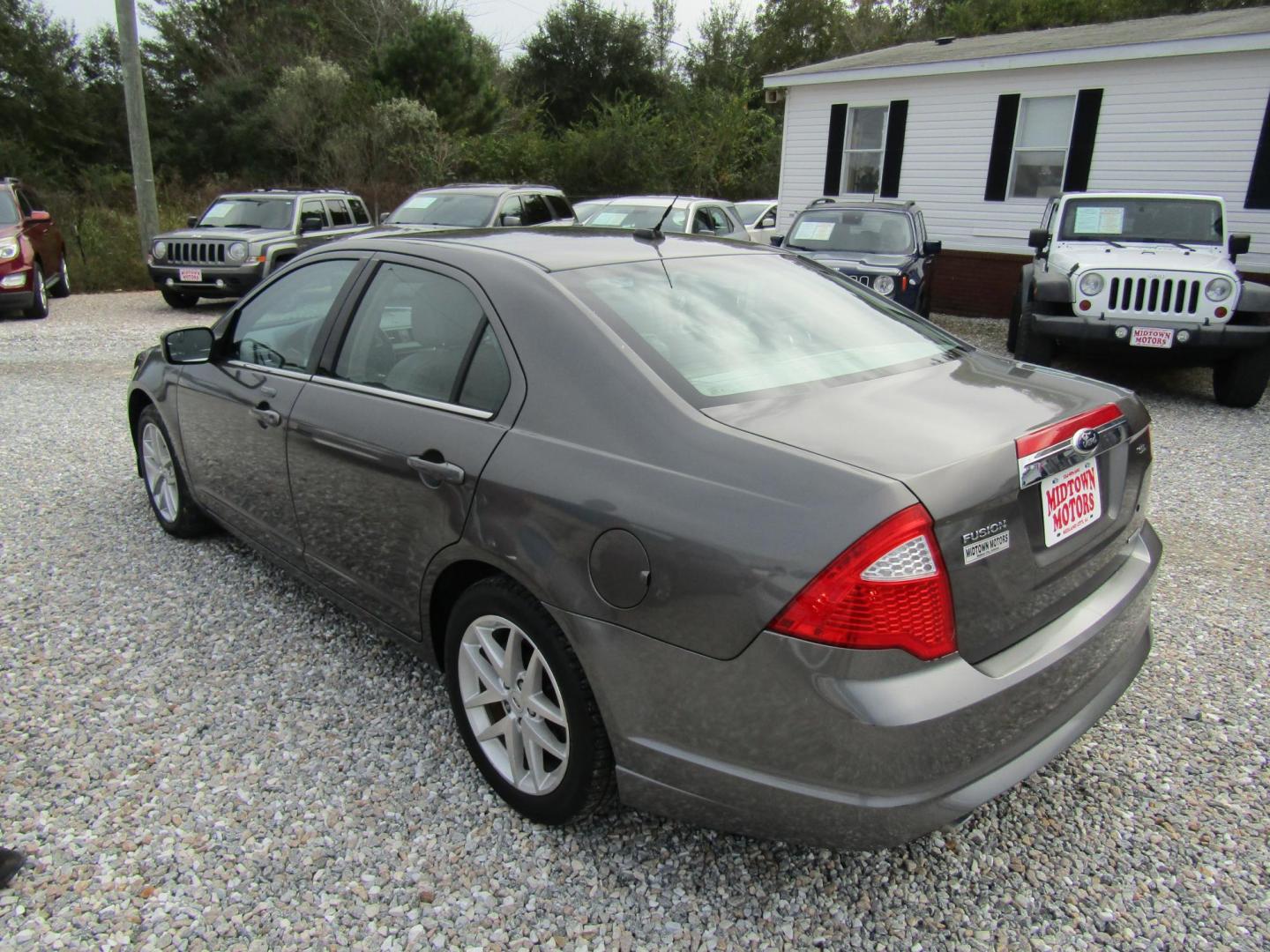 2012 Gray Ford Fusion SEL (3FAHP0JG0CR) with an 3.0L V6 DOHC 24V engine, Automatic transmission, located at 15016 S Hwy 231, Midland City, AL, 36350, (334) 983-3001, 31.306210, -85.495277 - Photo#5