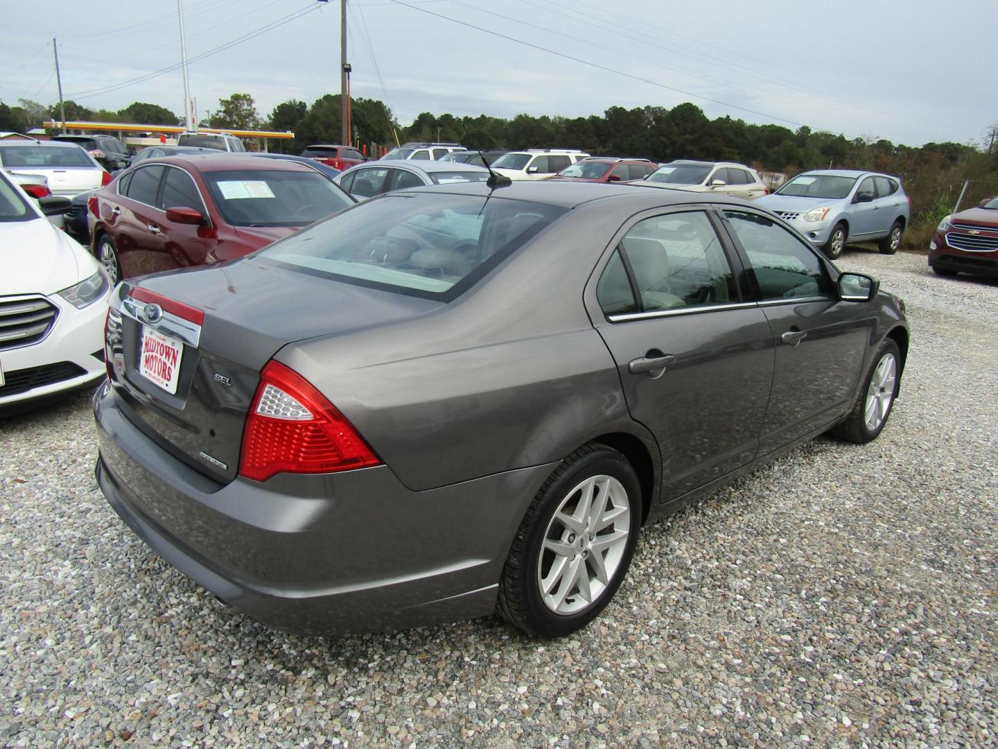 2012 Gray Ford Fusion SEL (3FAHP0JG0CR) with an 3.0L V6 DOHC 24V engine, Automatic transmission, located at 15016 S Hwy 231, Midland City, AL, 36350, (334) 983-3001, 31.306210, -85.495277 - Photo#7