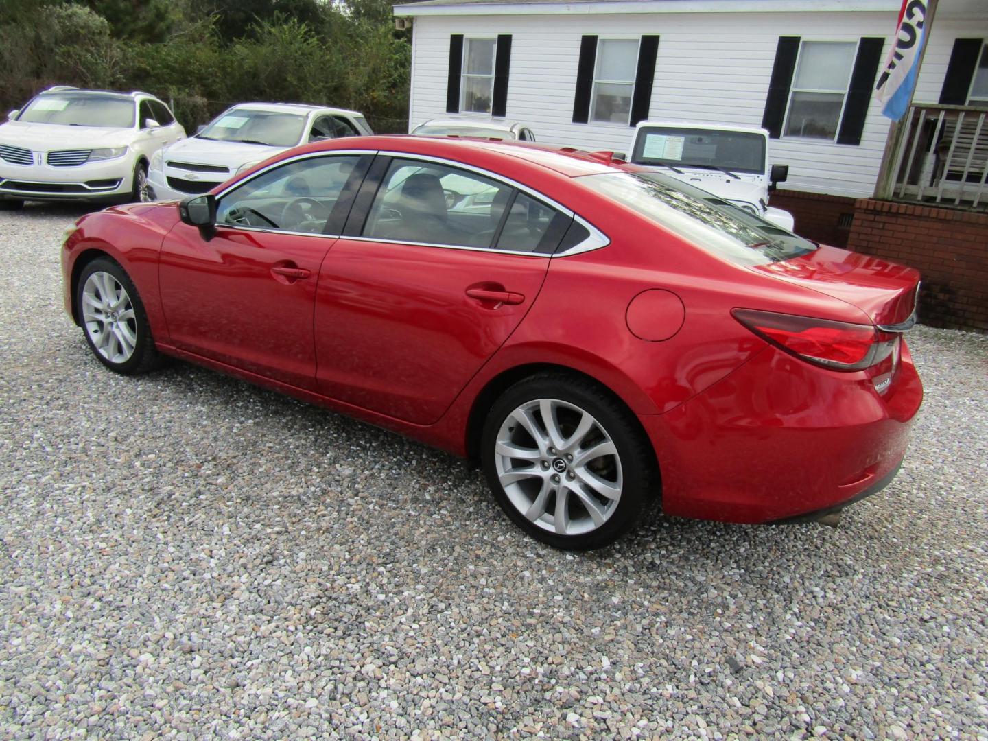 2016 Red Mazda Mazda6 i Touring (JM1GJ1V55G1) with an 2.5L L4 DOHC 16V engine, Automatic transmission, located at 15016 S Hwy 231, Midland City, AL, 36350, (334) 983-3001, 31.306210, -85.495277 - Photo#5