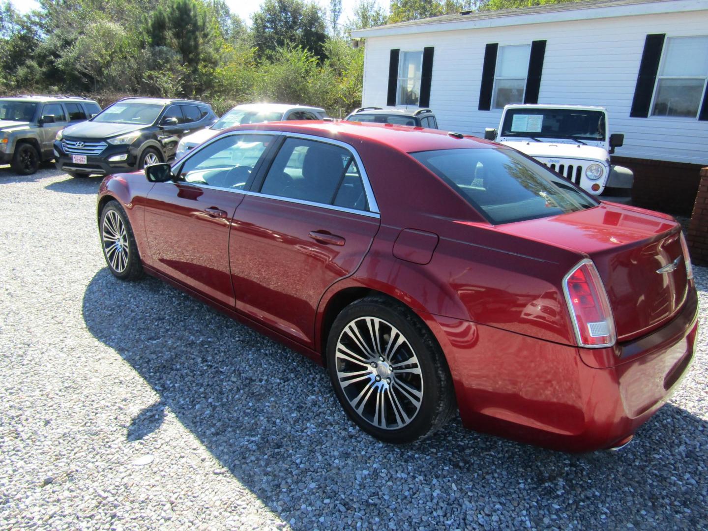 2012 Red Chrysler 300 S V6 RWD (2C3CCABG2CH) with an 3.6L V6 DOHC 24V engine, Automatic transmission, located at 15016 S Hwy 231, Midland City, AL, 36350, (334) 983-3001, 31.306210, -85.495277 - Photo#7