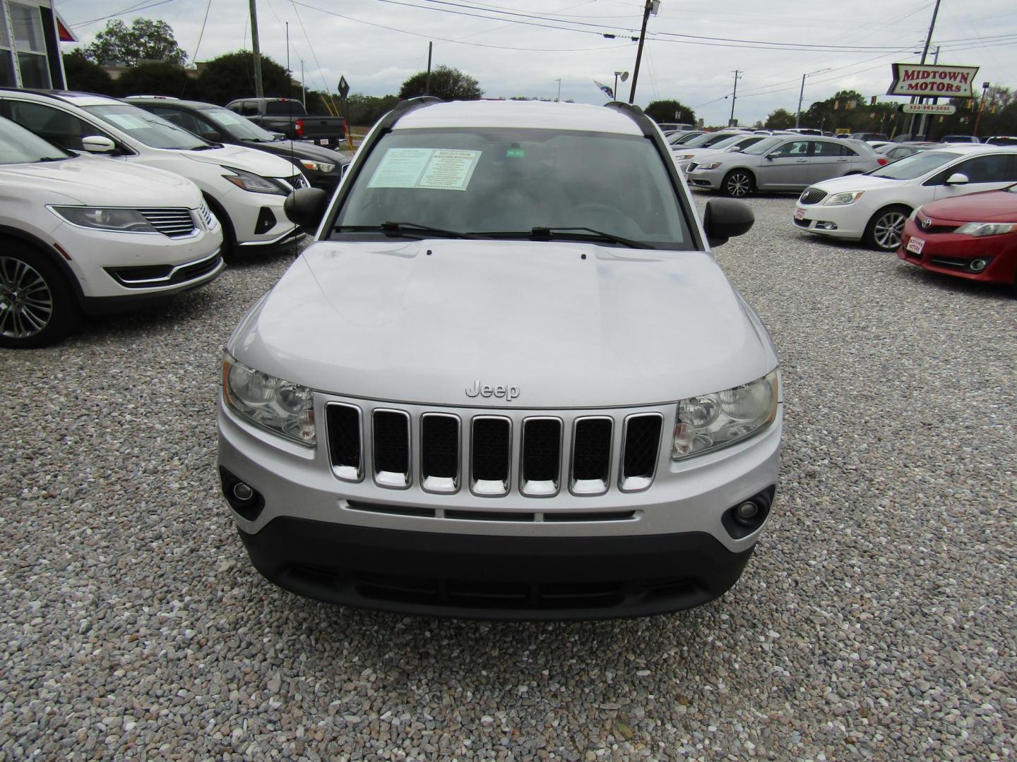 2011 Silver Jeep Compass Sport FWD (1J4NT1FA1BD) with an 2.0L L4 DOHC 16V engine, Automatic transmission, located at 15016 S Hwy 231, Midland City, AL, 36350, (334) 983-3001, 31.306210, -85.495277 - Photo#1