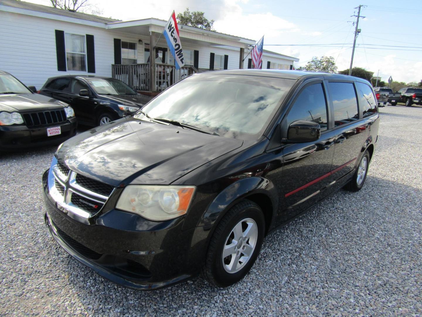 2012 Black Dodge Grand Caravan SXT (2C4RDGCG5CR) with an 3.6L V6 DOHC 24V engine, Automatic transmission, located at 15016 S Hwy 231, Midland City, AL, 36350, (334) 983-3001, 31.306210, -85.495277 - Photo#2