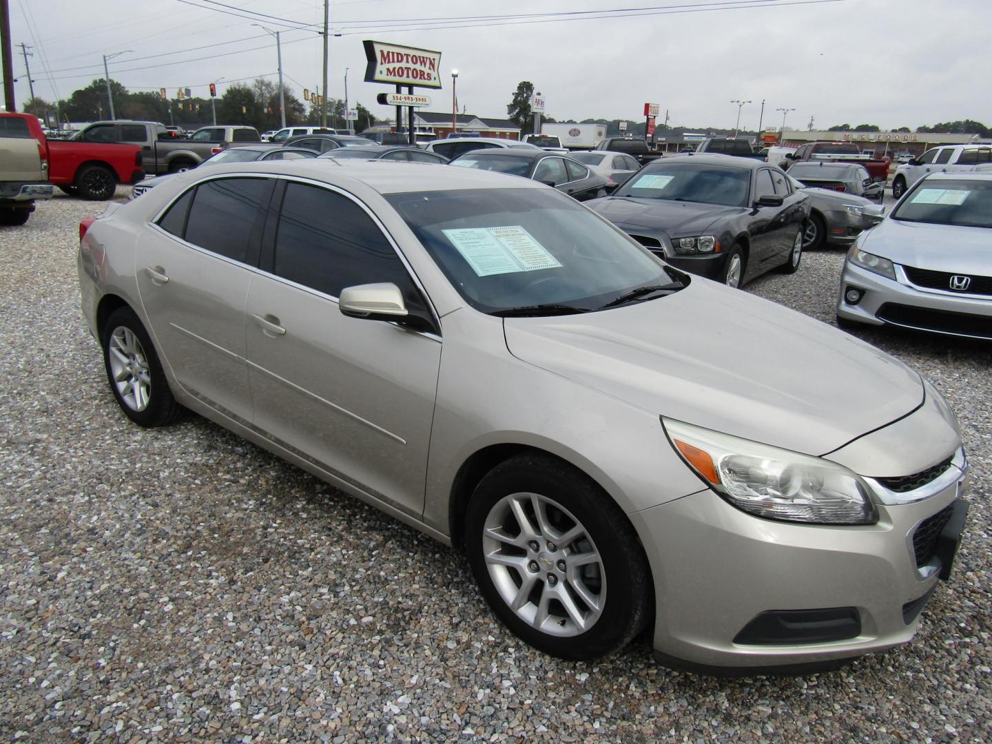 2015 Gold Chevrolet Malibu 1LT (1G11C5SLXFF) with an 2.5L L4 DOHC 16V engine, Automatic transmission, located at 15016 S Hwy 231, Midland City, AL, 36350, (334) 983-3001, 31.306210, -85.495277 - Photo#0