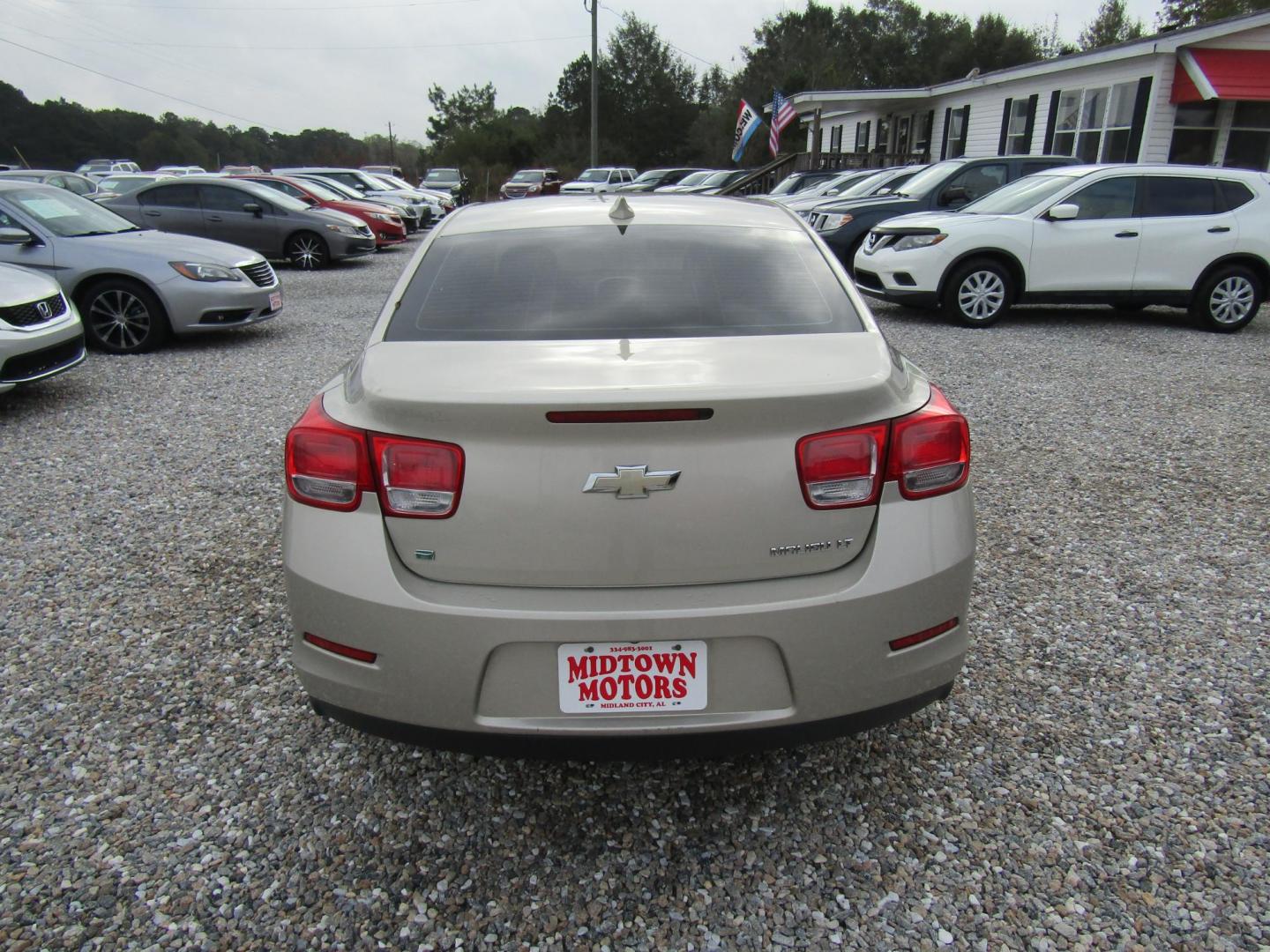 2015 Gold Chevrolet Malibu 1LT (1G11C5SLXFF) with an 2.5L L4 DOHC 16V engine, Automatic transmission, located at 15016 S Hwy 231, Midland City, AL, 36350, (334) 983-3001, 31.306210, -85.495277 - Photo#6