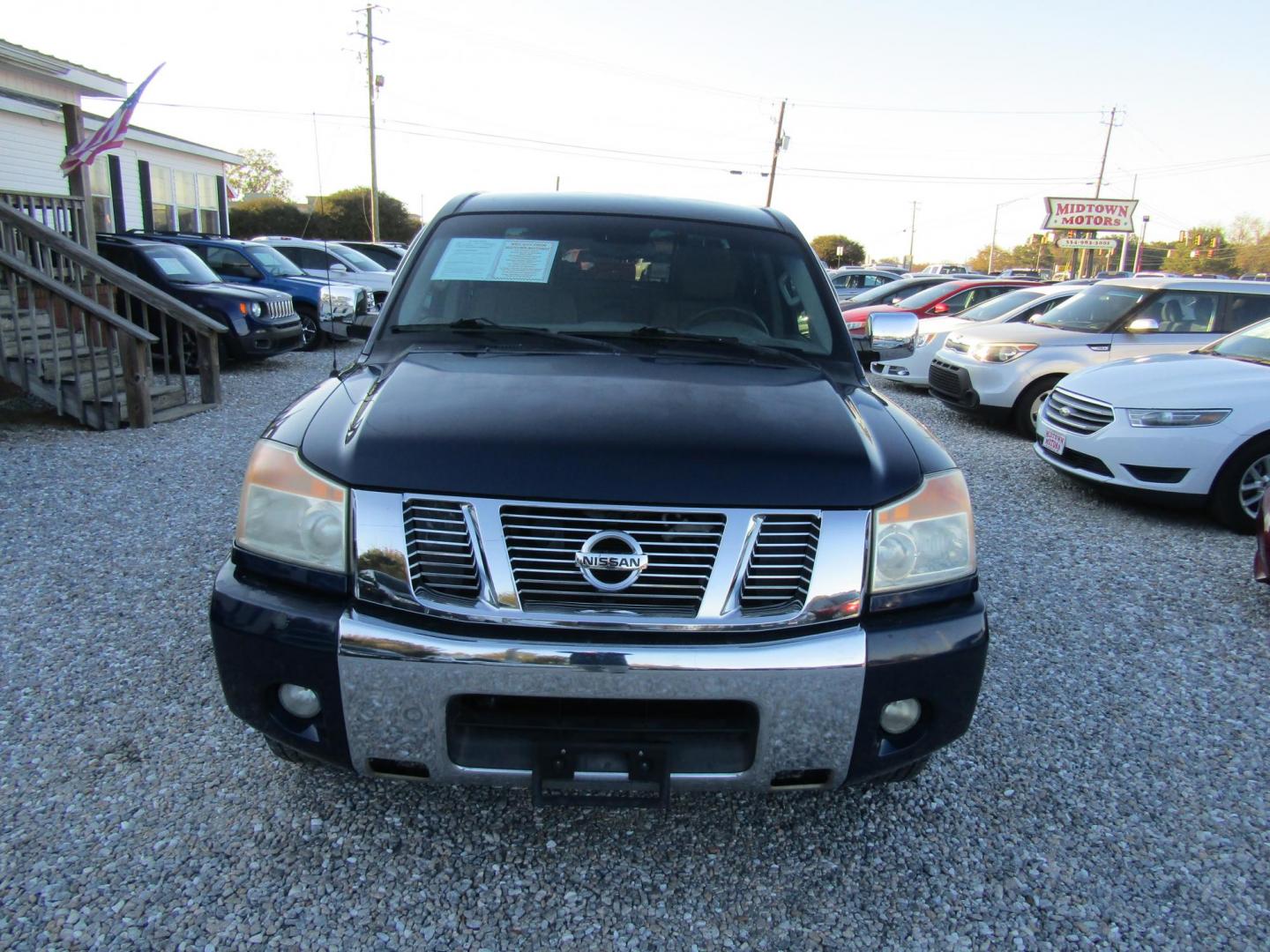 2012 Blue Nissan Titan SL Crew Cab 2WD (1N6AA0EDXCN) with an 5.6L V8 DOHC 32V engine, Automatic transmission, located at 15016 S Hwy 231, Midland City, AL, 36350, (334) 983-3001, 31.306210, -85.495277 - Photo#1