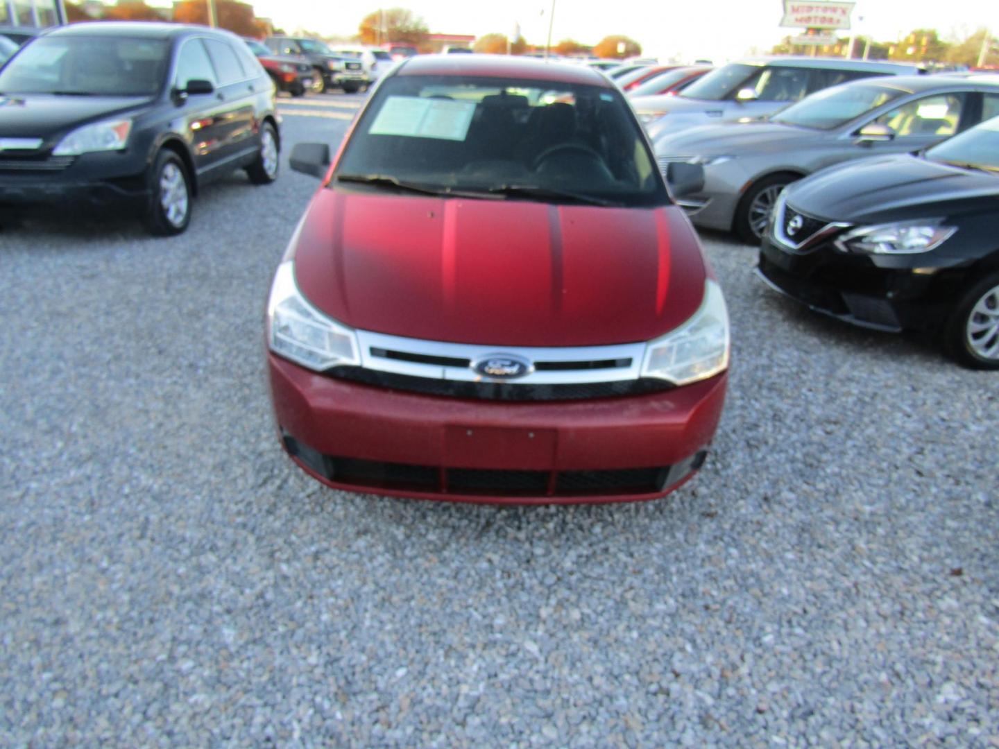 2009 Red Ford Focus SE Sedan (1FAHP35N99W) with an 2.0L L4 DOHC 16V engine, Automatic transmission, located at 15016 S Hwy 231, Midland City, AL, 36350, (334) 983-3001, 31.306210, -85.495277 - Photo#1