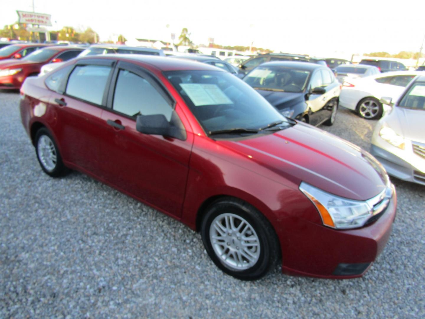 2009 Red Ford Focus SE Sedan (1FAHP35N99W) with an 2.0L L4 DOHC 16V engine, Automatic transmission, located at 15016 S Hwy 231, Midland City, AL, 36350, (334) 983-3001, 31.306210, -85.495277 - Photo#0