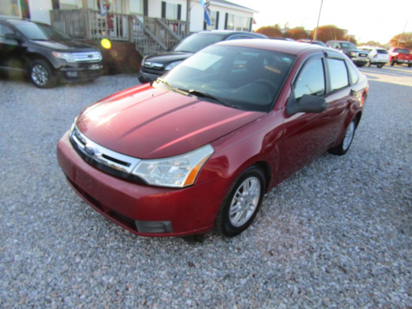 2009 Red Ford Focus SE Sedan (1FAHP35N99W) with an 2.0L L4 DOHC 16V engine, Automatic transmission, located at 15016 S Hwy 231, Midland City, AL, 36350, (334) 983-3001, 31.306210, -85.495277 - Photo#2