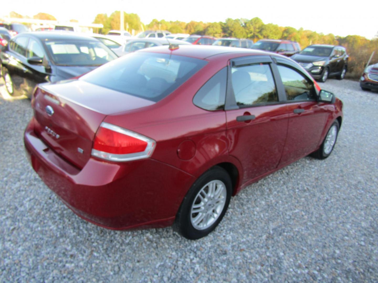 2009 Red Ford Focus SE Sedan (1FAHP35N99W) with an 2.0L L4 DOHC 16V engine, Automatic transmission, located at 15016 S Hwy 231, Midland City, AL, 36350, (334) 983-3001, 31.306210, -85.495277 - Photo#7