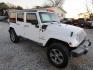 2016 White Jeep Wrangler Unlimited Sahara 4WD (1C4BJWEG9GL) with an 3.6L V6 DOHC 24V FFV engine, Automatic transmission, located at 15016 S Hwy 231, Midland City, AL, 36350, (334) 983-3001, 31.306210, -85.495277 - Photo#0