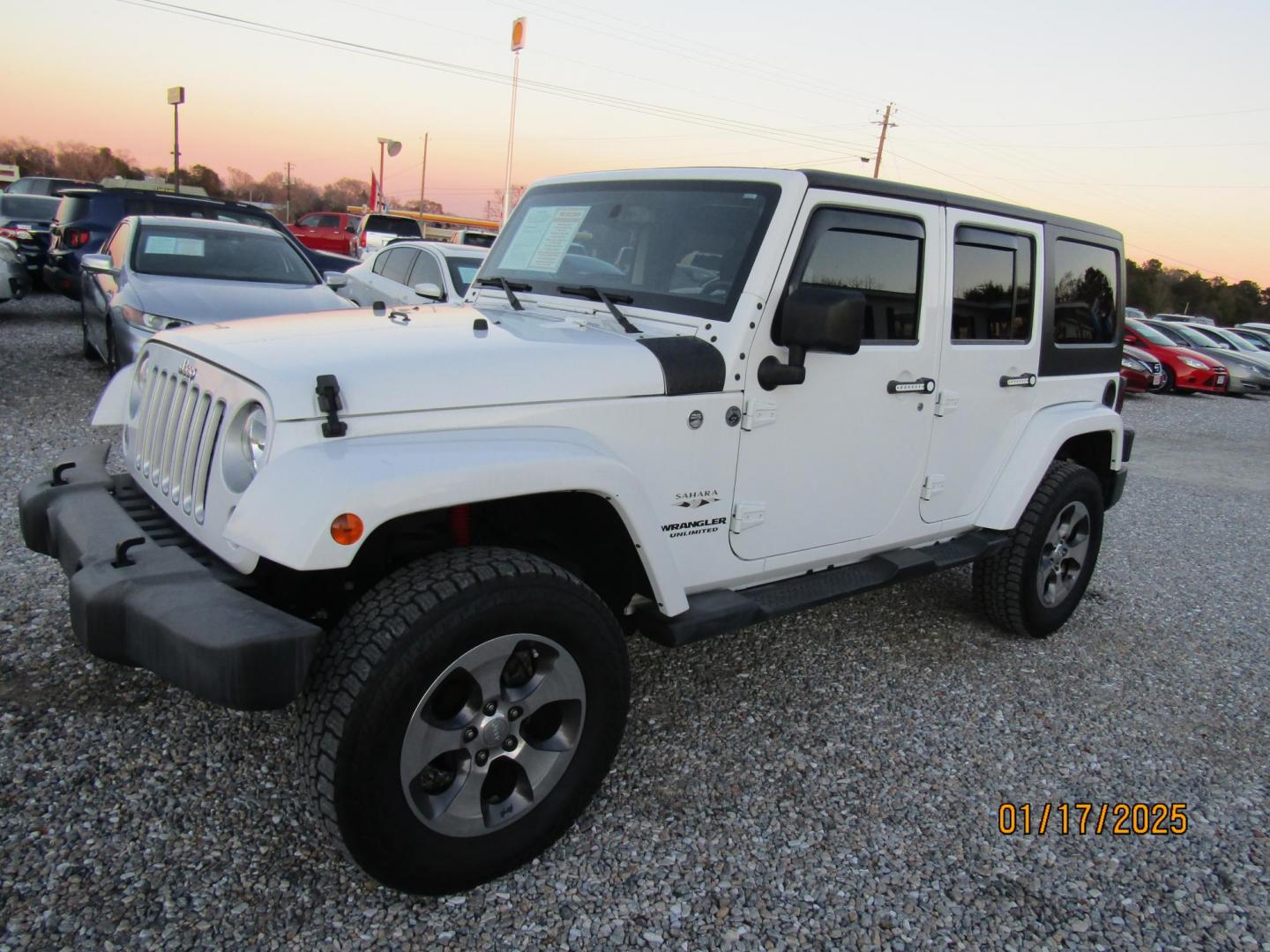 2016 White Jeep Wrangler Unlimited Sahara 4WD (1C4BJWEG9GL) with an 3.6L V6 DOHC 24V FFV engine, Automatic transmission, located at 15016 S Hwy 231, Midland City, AL, 36350, (334) 983-3001, 31.306210, -85.495277 - Photo#2