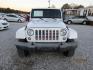 2016 White Jeep Wrangler Unlimited Sahara 4WD (1C4BJWEG9GL) with an 3.6L V6 DOHC 24V FFV engine, Automatic transmission, located at 15016 S Hwy 231, Midland City, AL, 36350, (334) 983-3001, 31.306210, -85.495277 - Photo#1