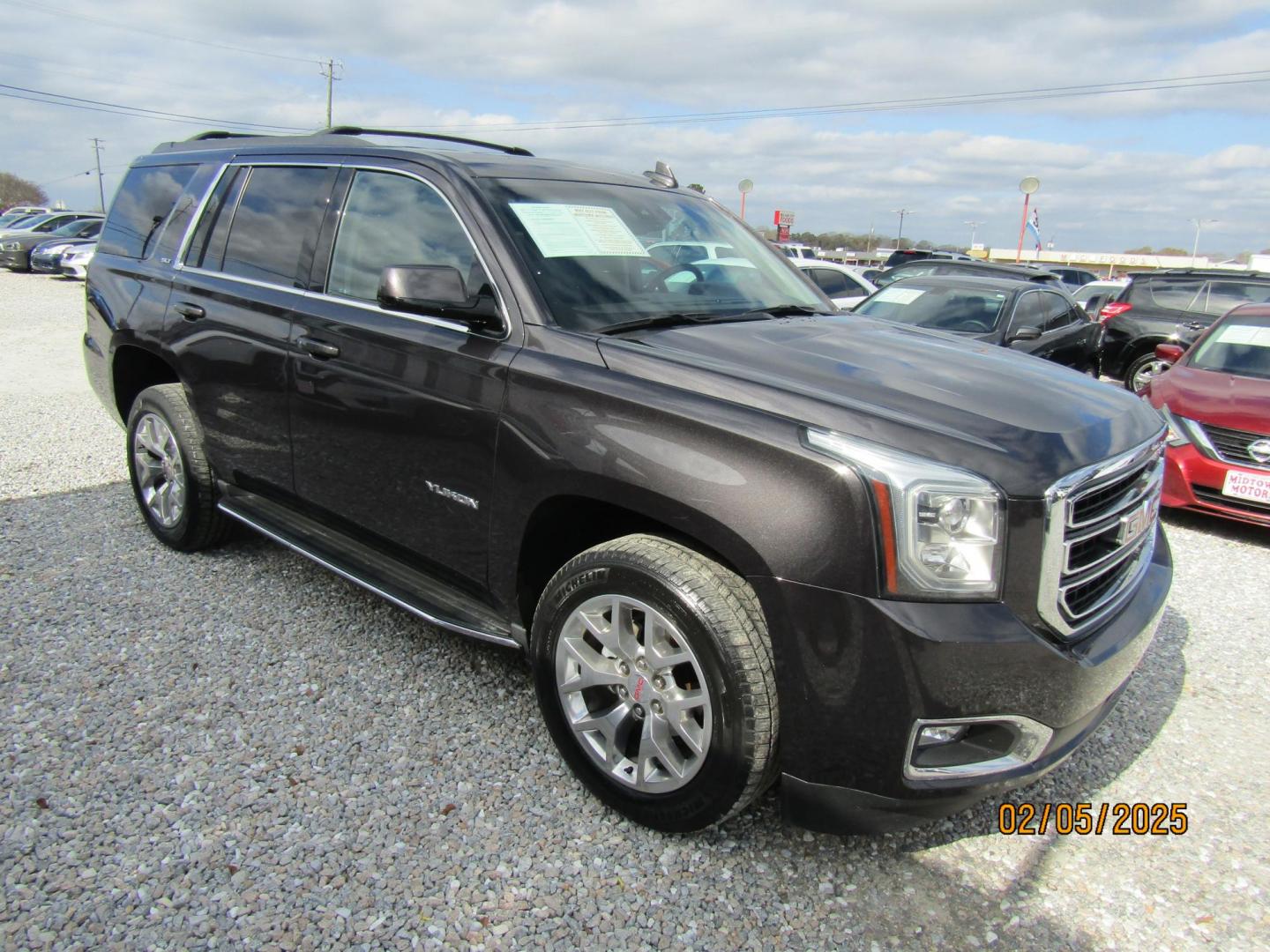 2016 Dark Gray GMC Yukon SLT 2WD (1GKS1BKC3GR) with an 5.3L V8 OHV 16V engine, Automatic transmission, located at 15016 S Hwy 231, Midland City, AL, 36350, (334) 983-3001, 31.306210, -85.495277 - Photo#0