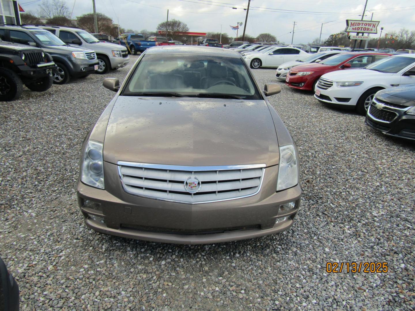 2006 Beige Cadillac STS V6 (1G6DW677860) with an 3.6L V6 DOHC 24V engine, Automatic transmission, located at 15016 S Hwy 231, Midland City, AL, 36350, (334) 983-3001, 31.306210, -85.495277 - Photo#1